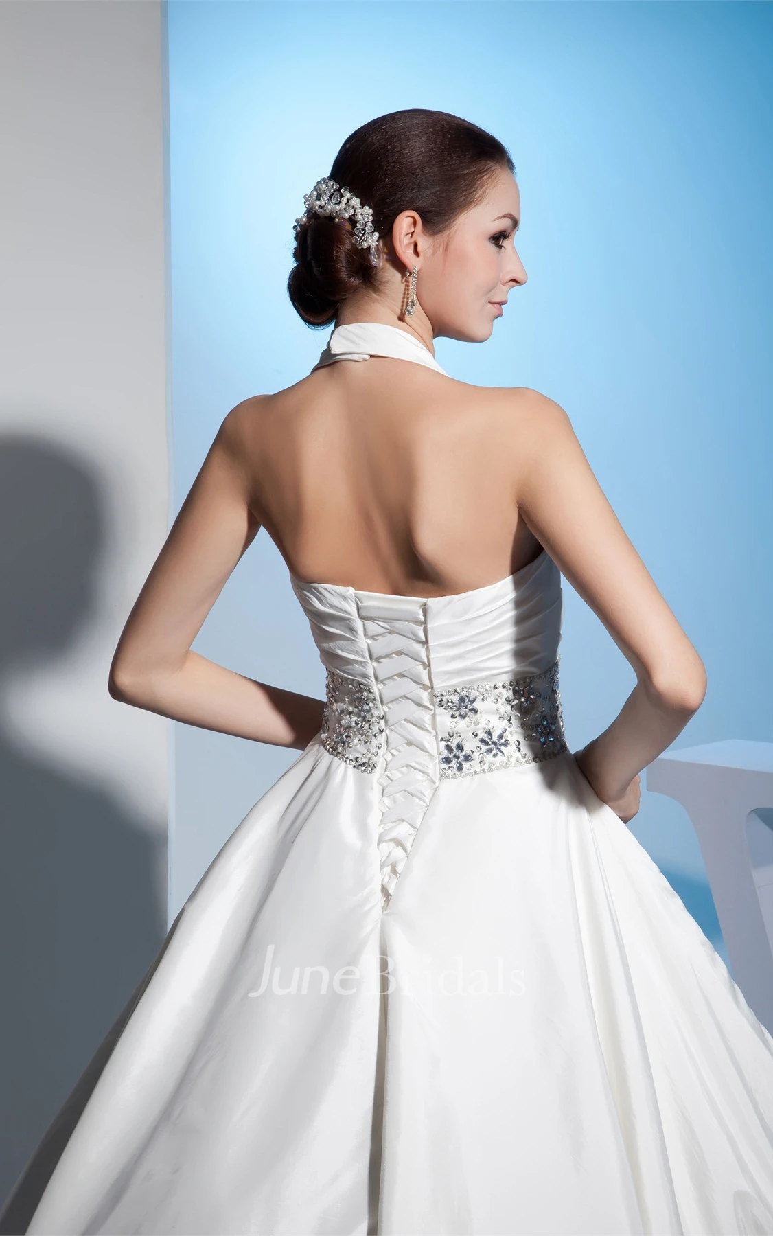 Plunged Sleeveless Ball Gown with Central Ruching and Gemmed Waist