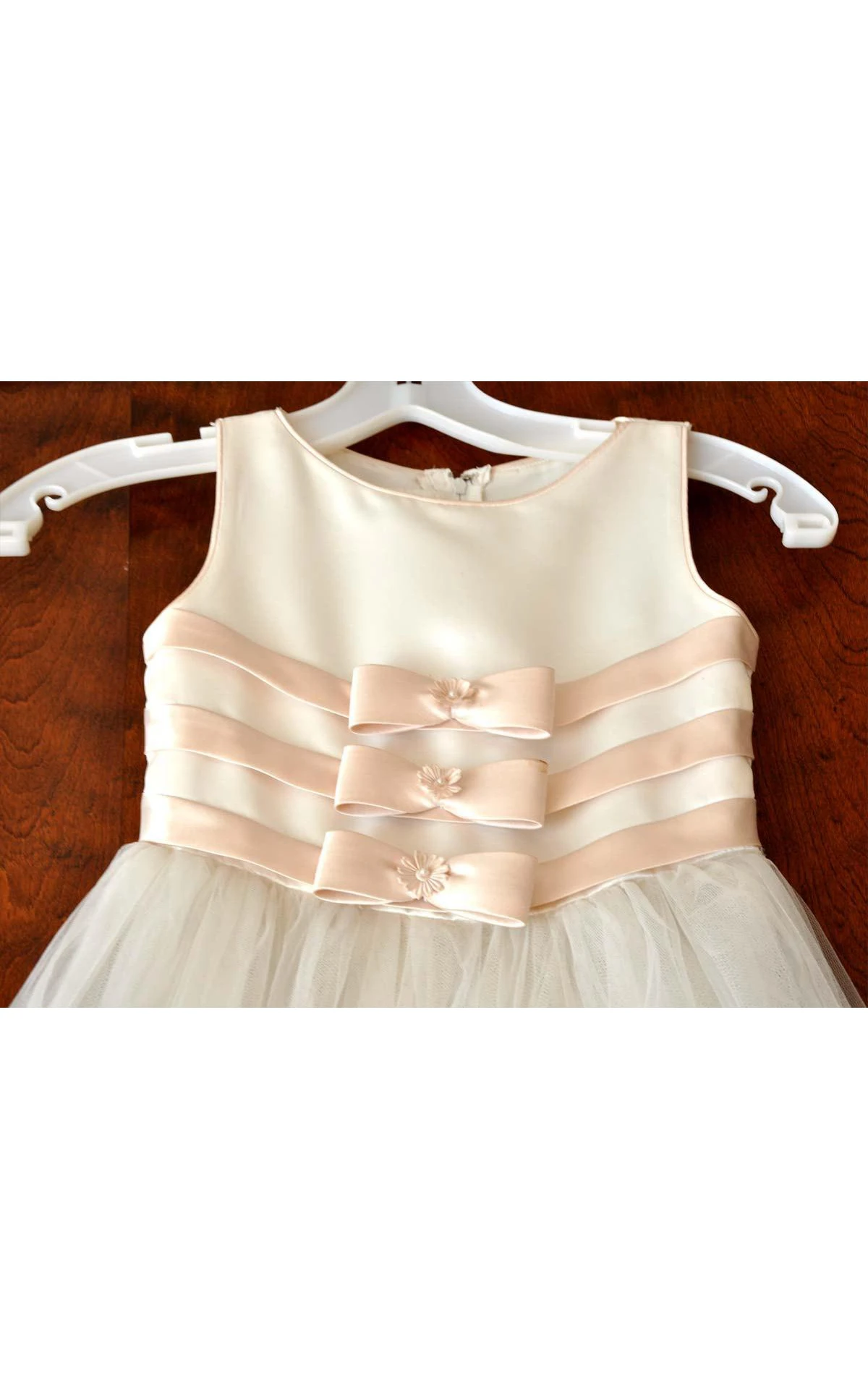 Mon Cheri Ivory Sleeveless Bateau Neck Flower Girl Tulle Dress With Flower Detailing