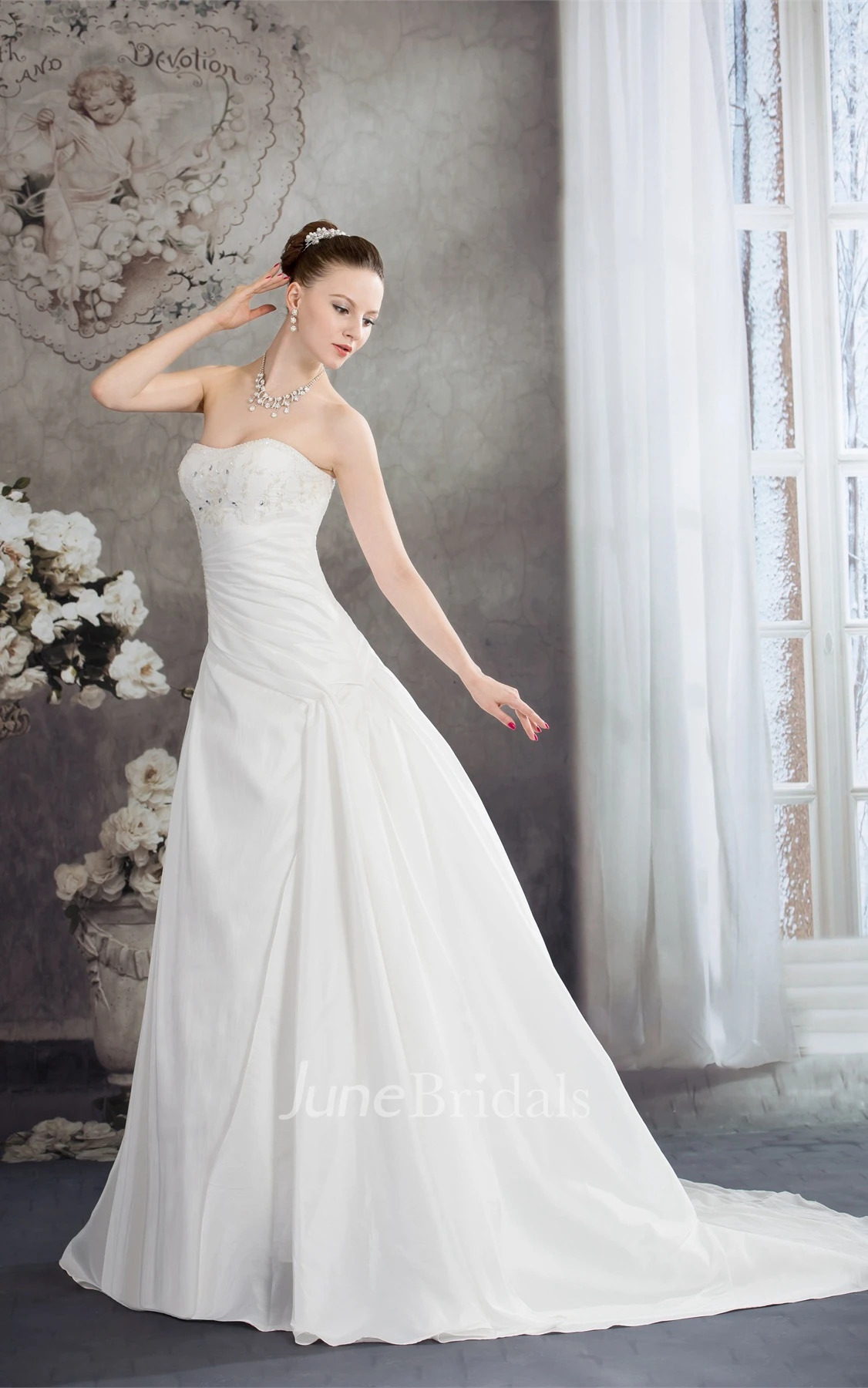 Strapless Appliqued Ball Gown with Beading and Ruching