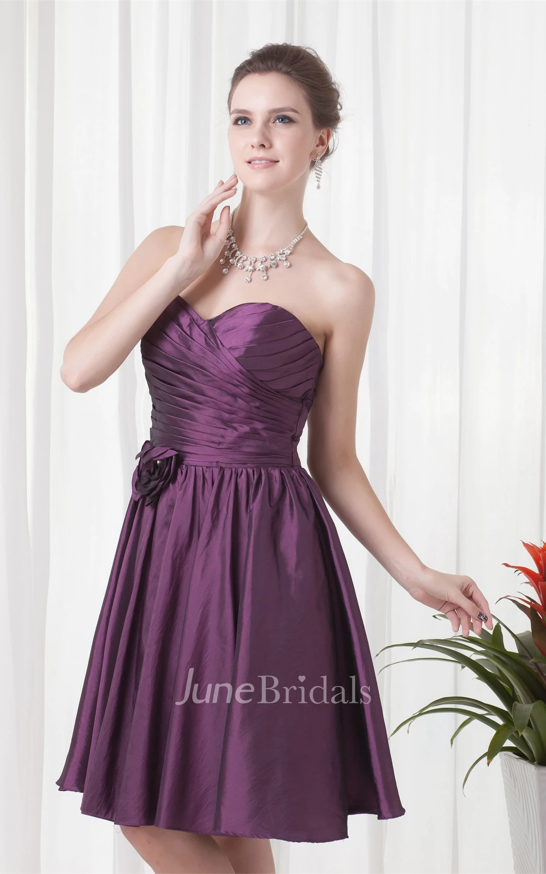sweetheart knee-length criss-cross dress with pleats and flower
