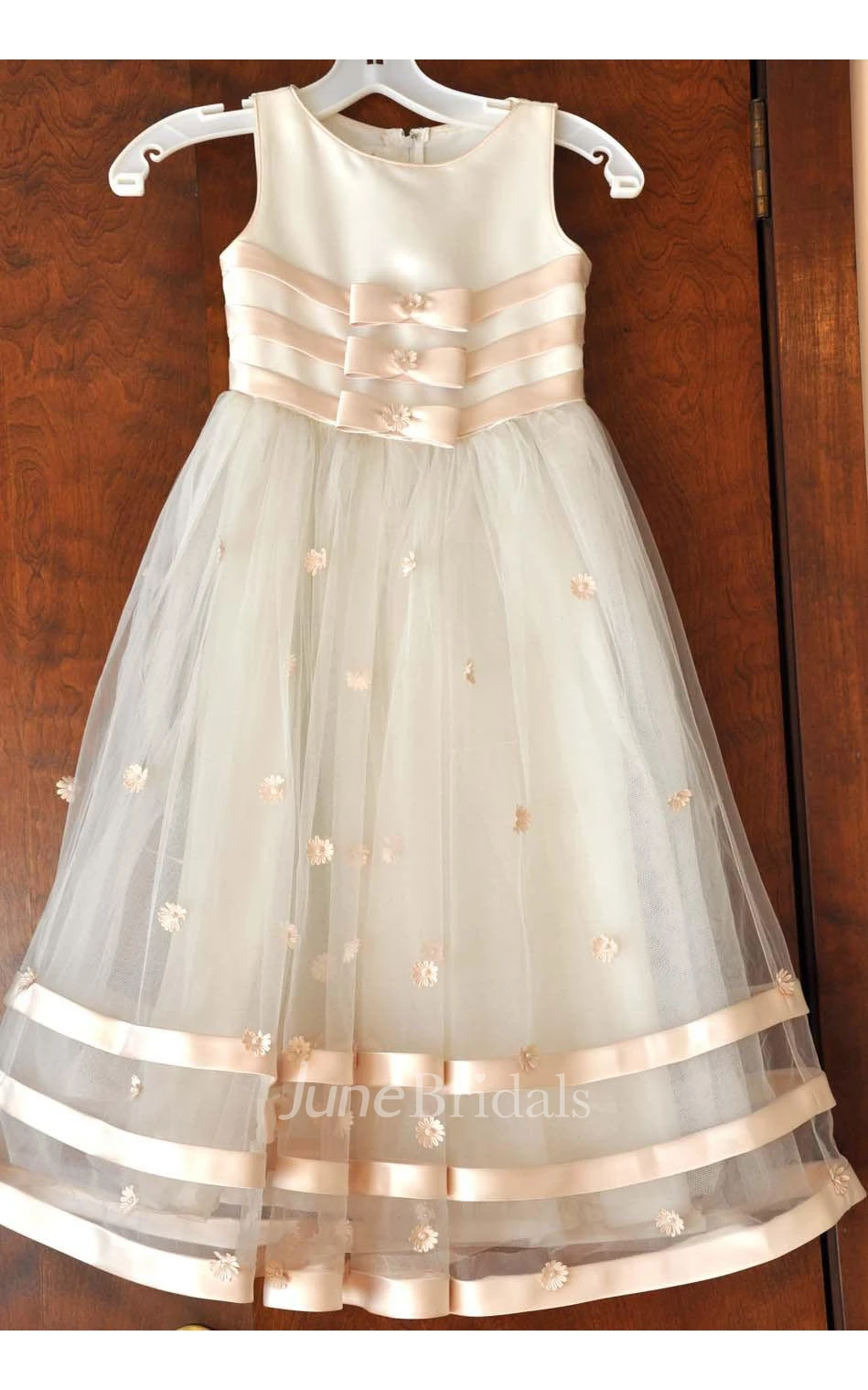 Mon Cheri Ivory Sleeveless Bateau Neck Flower Girl Tulle Dress With Flower Detailing