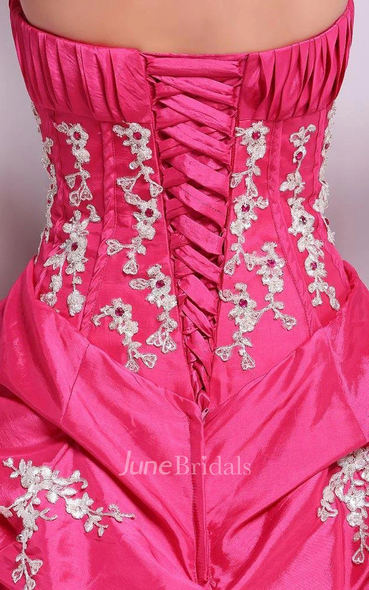 Strapless Ball Gown With Ruffles and Flower Detail