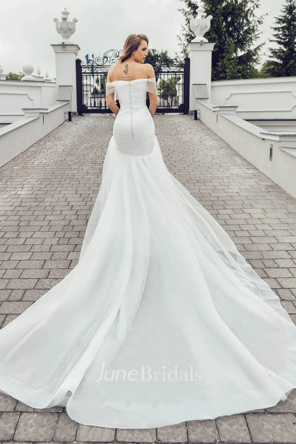 Elegant Off-the-shoulder Short Sleeve Wedding Dress with Chapel Train
