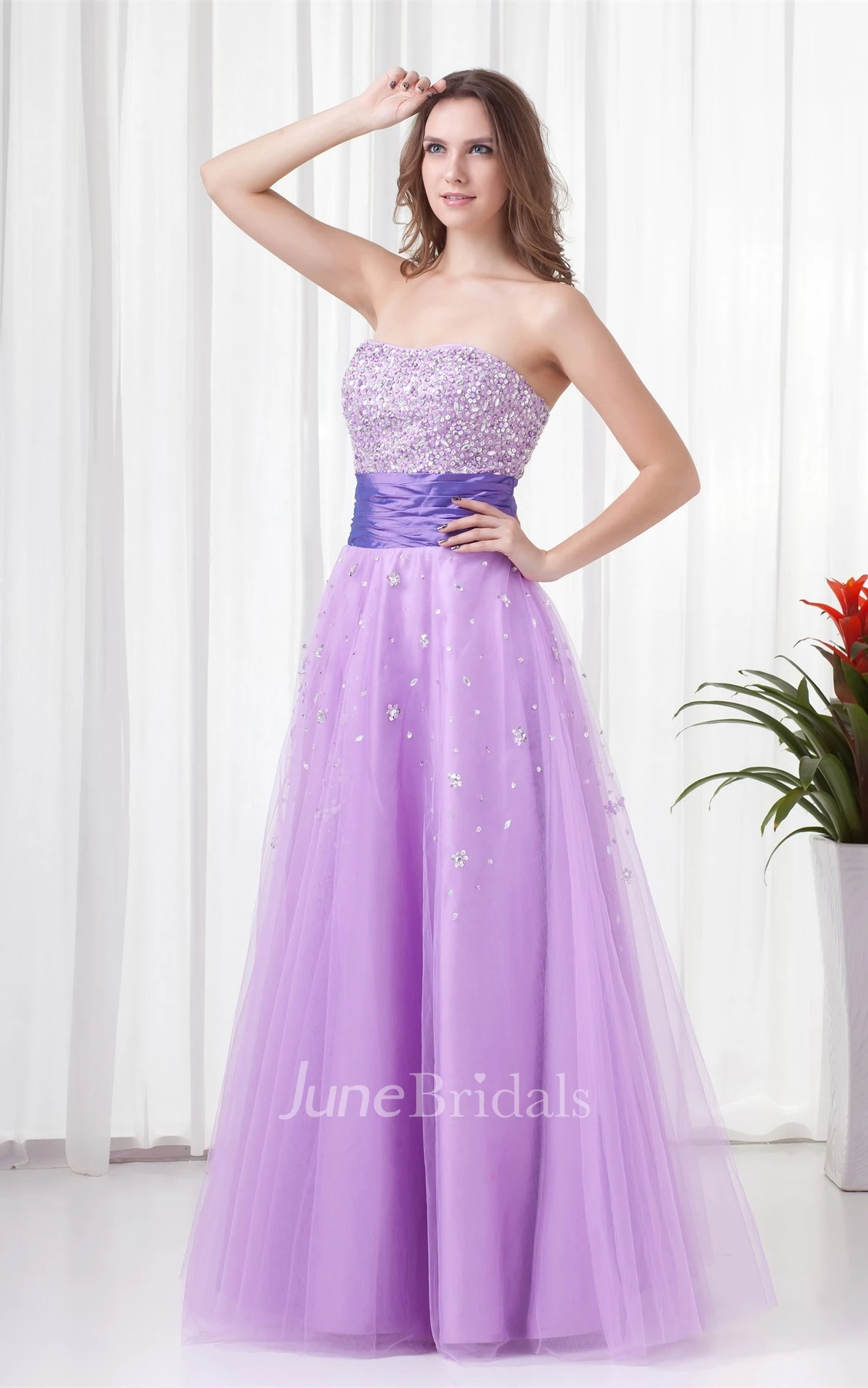 strapless a-line tulle dress with ruched waist and jeweled top