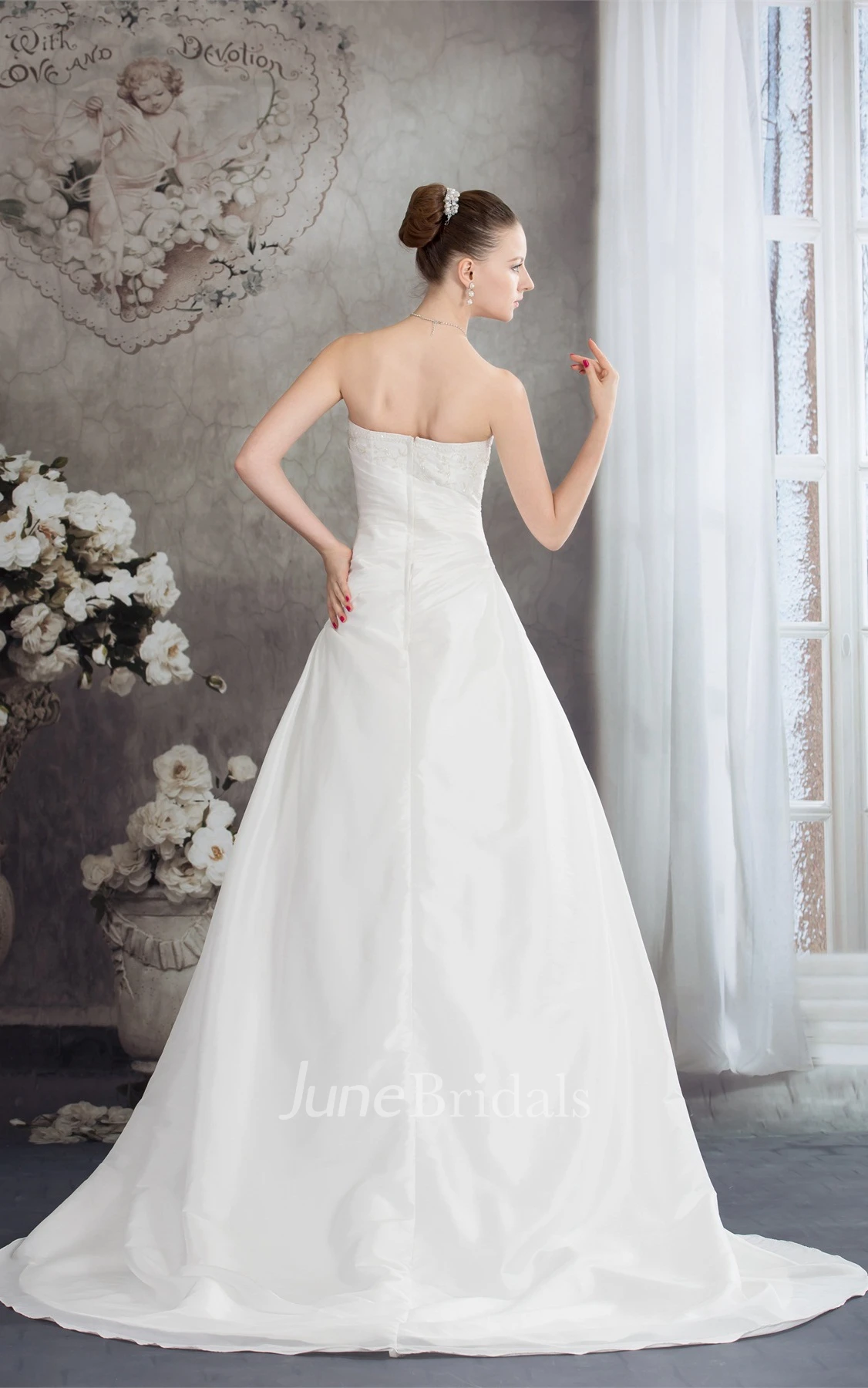 Strapless Appliqued Ball Gown with Beading and Ruching