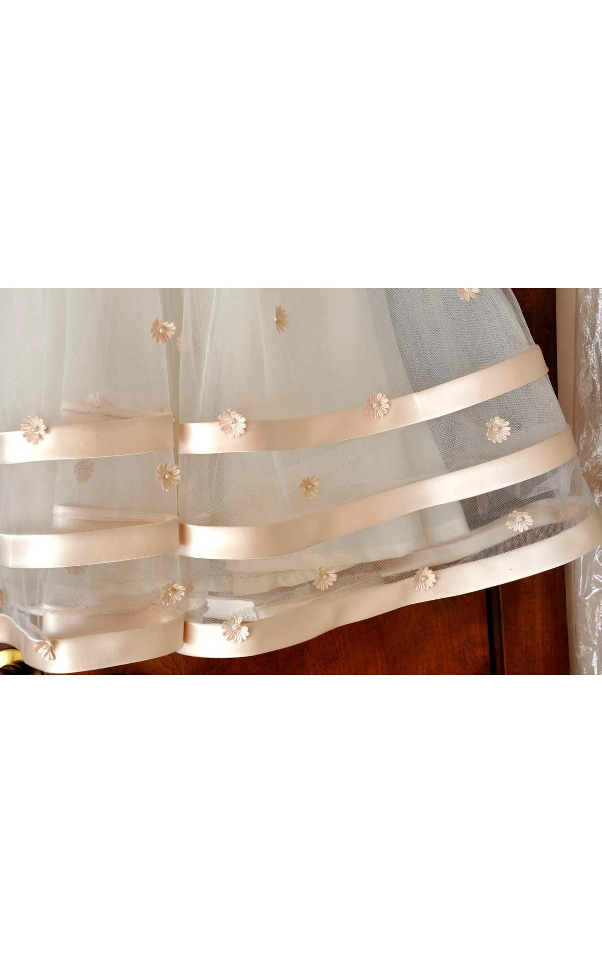 Mon Cheri Ivory Sleeveless Bateau Neck Flower Girl Tulle Dress With Flower Detailing