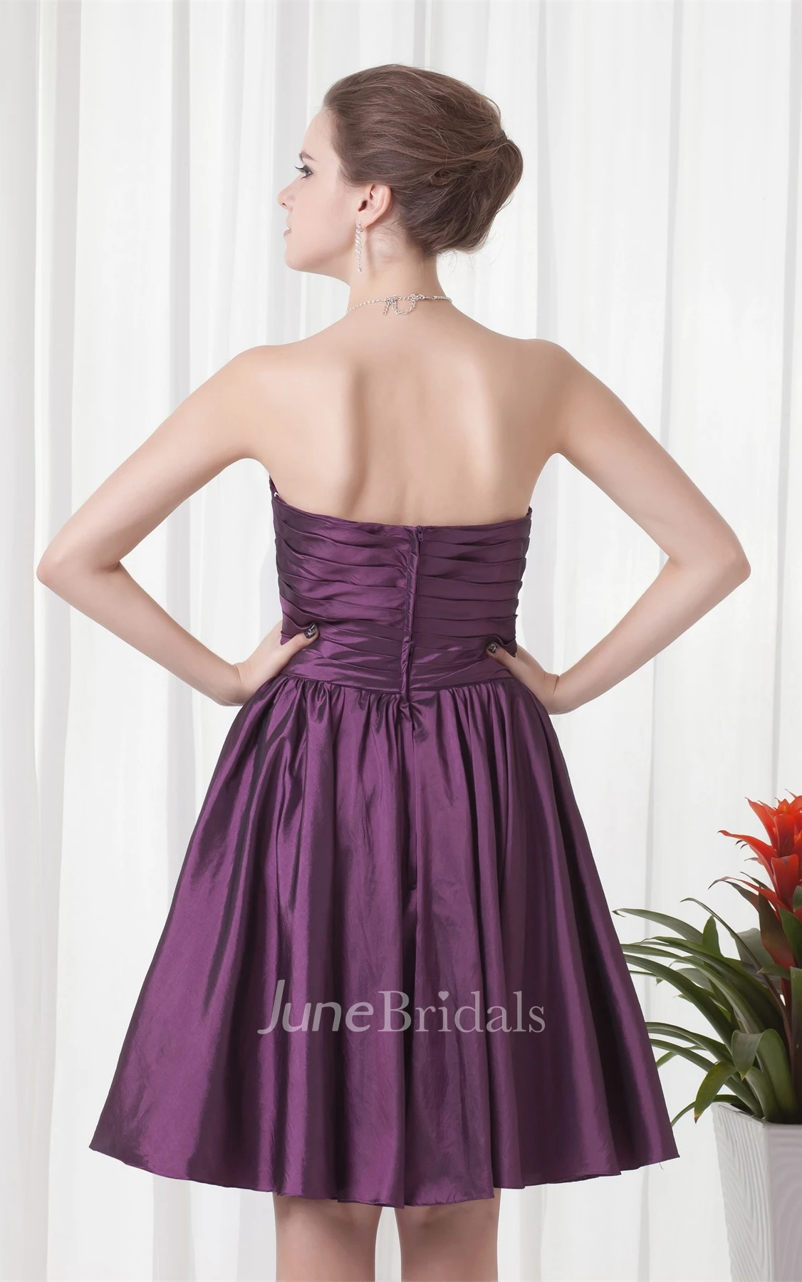 sweetheart knee-length criss-cross dress with pleats and flower