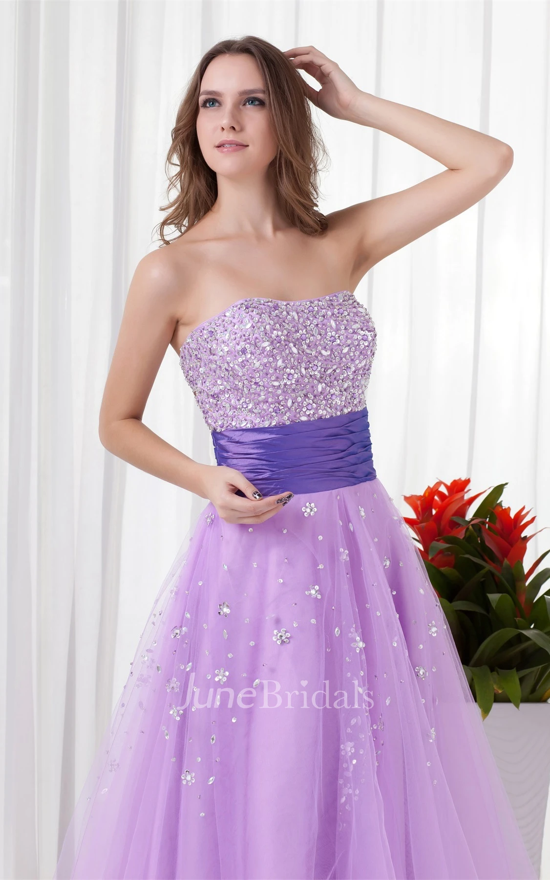 strapless a-line tulle dress with ruched waist and jeweled top