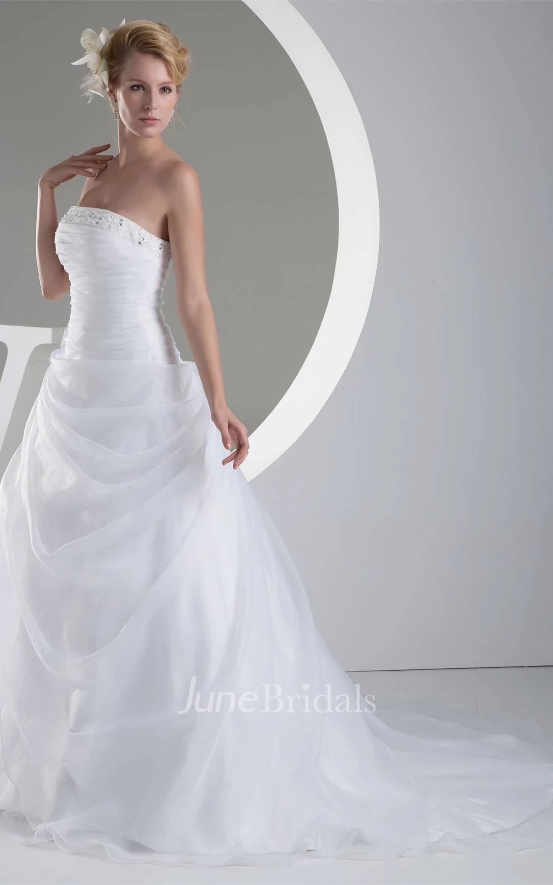 Strapless Ruched Jeweled Ball Gown with Flower and Ruffles