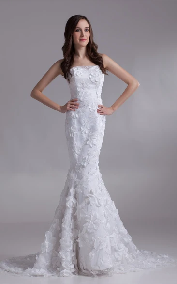 strapless lace mermaid dress with brush train and floral embellishment