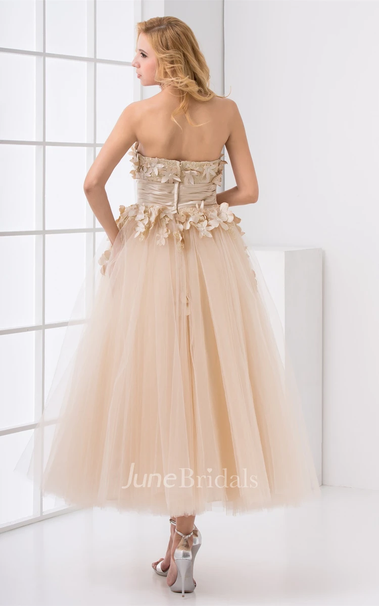 strapless ankle-length tulle dress with appliques and flower