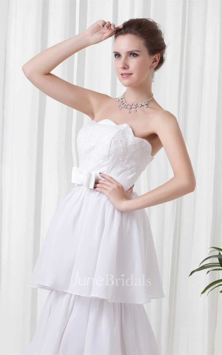 strapless tiered a-line dress with appliques and bow