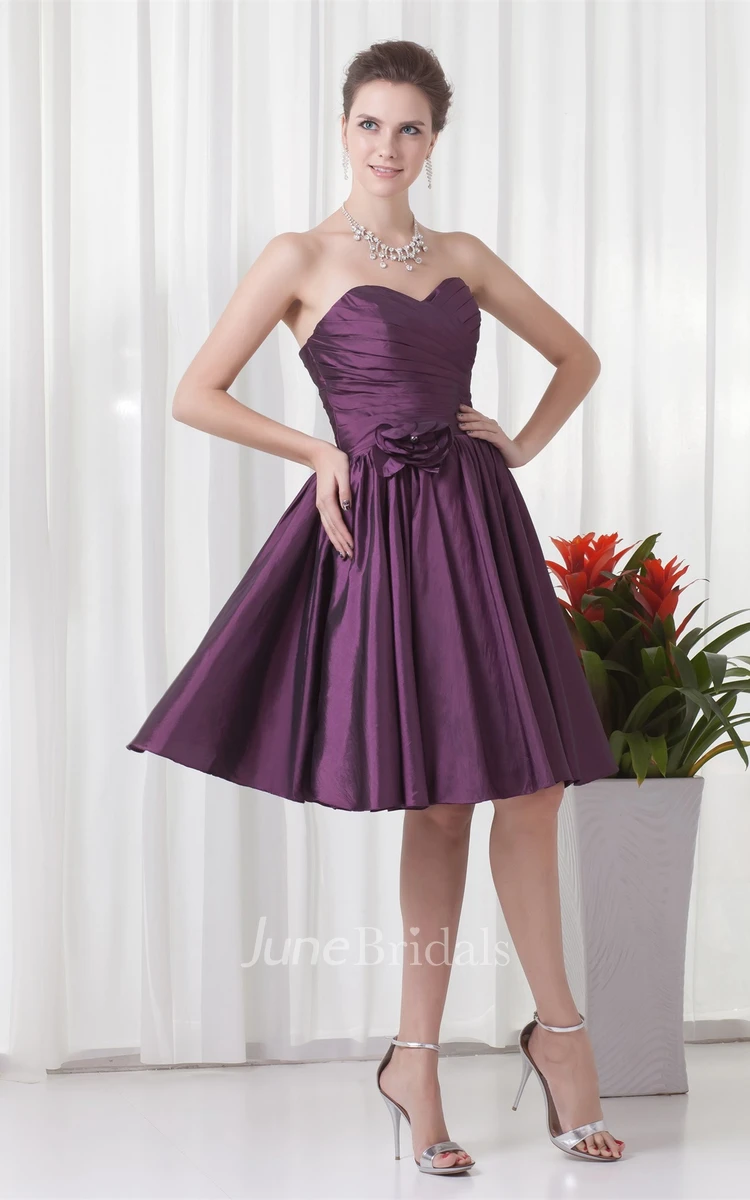 sweetheart knee-length criss-cross dress with pleats and flower