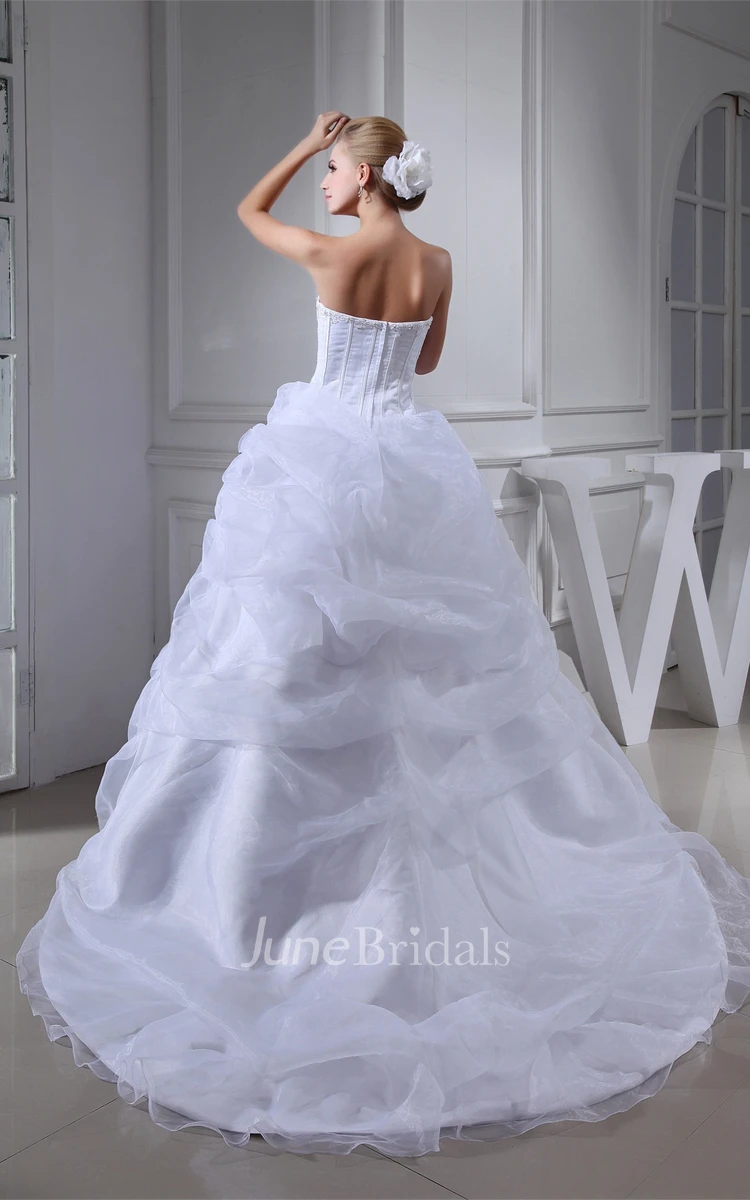 Strapless Ruffled Tulle Ball Gown with Flower and Gemmed Bodice