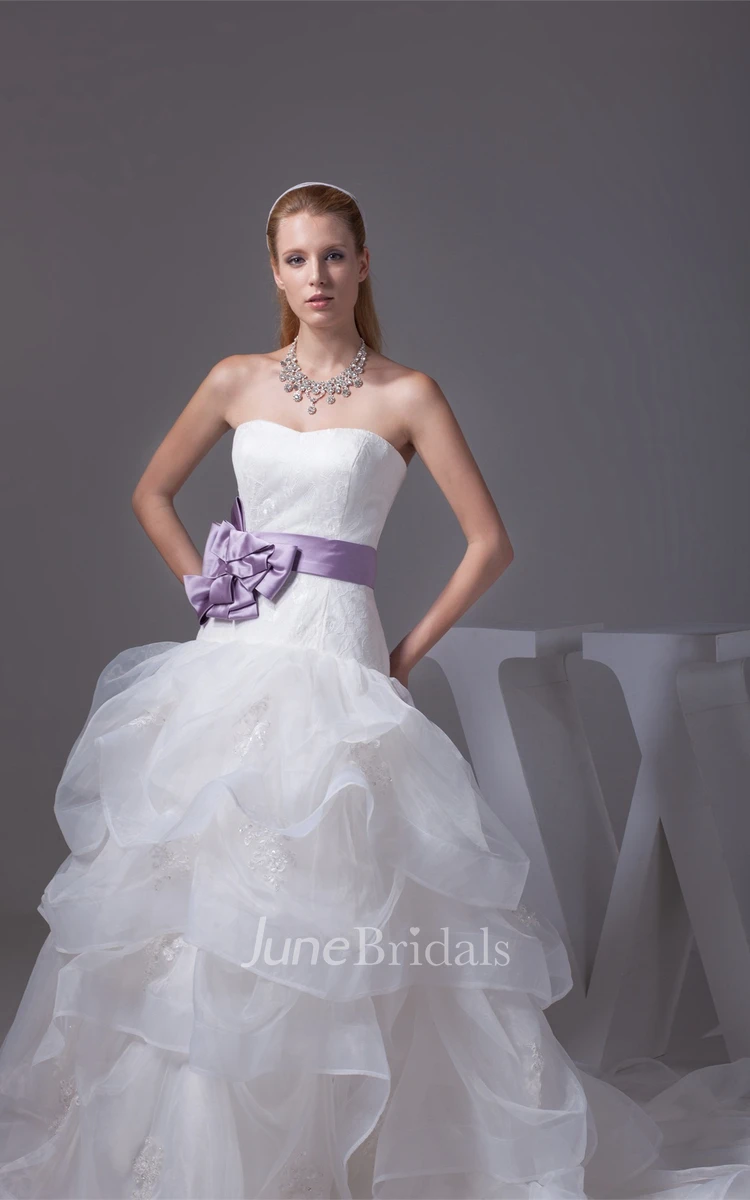 Strapless Ruffled Ball Gown with Bow and Appliques