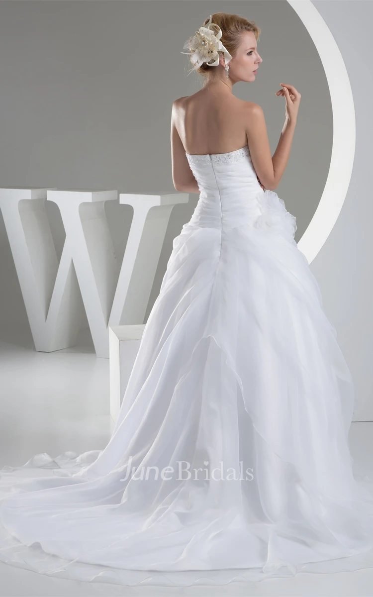 Strapless Ruched Jeweled Ball Gown with Flower and Ruffles