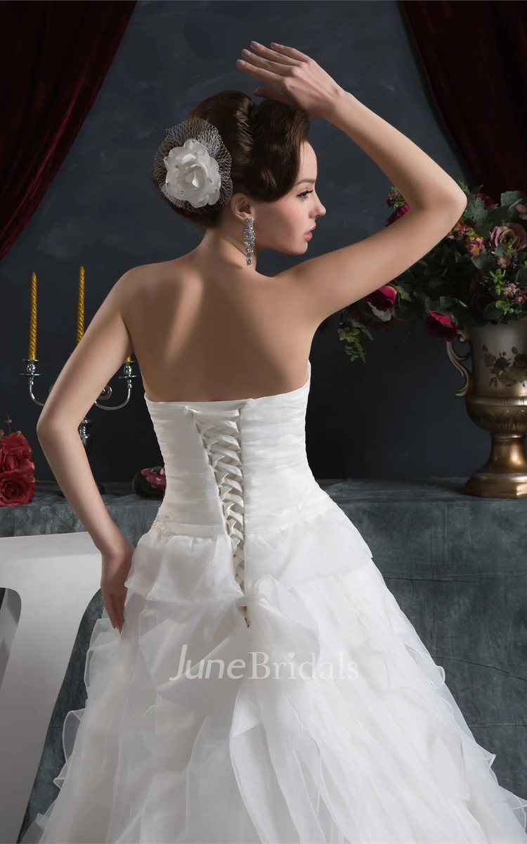 Sweetheart Criss-Cross Ball Gown with Ruffled Skirt and Stress