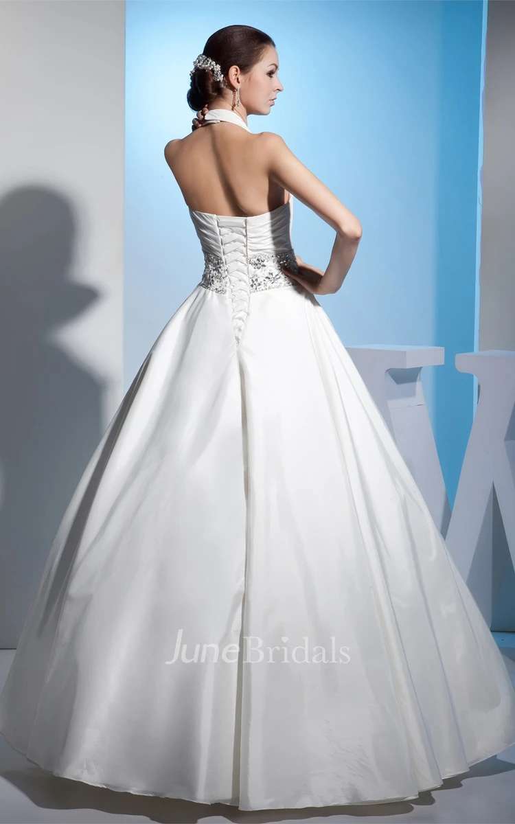 Plunged Sleeveless Ball Gown with Central Ruching and Gemmed Waist