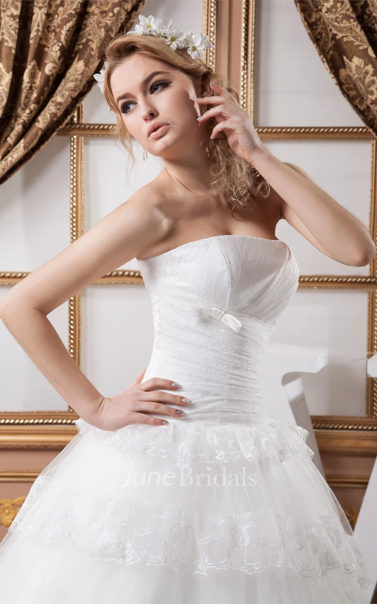 Strapless Tulle Ball Gown with Peplum and Appliques