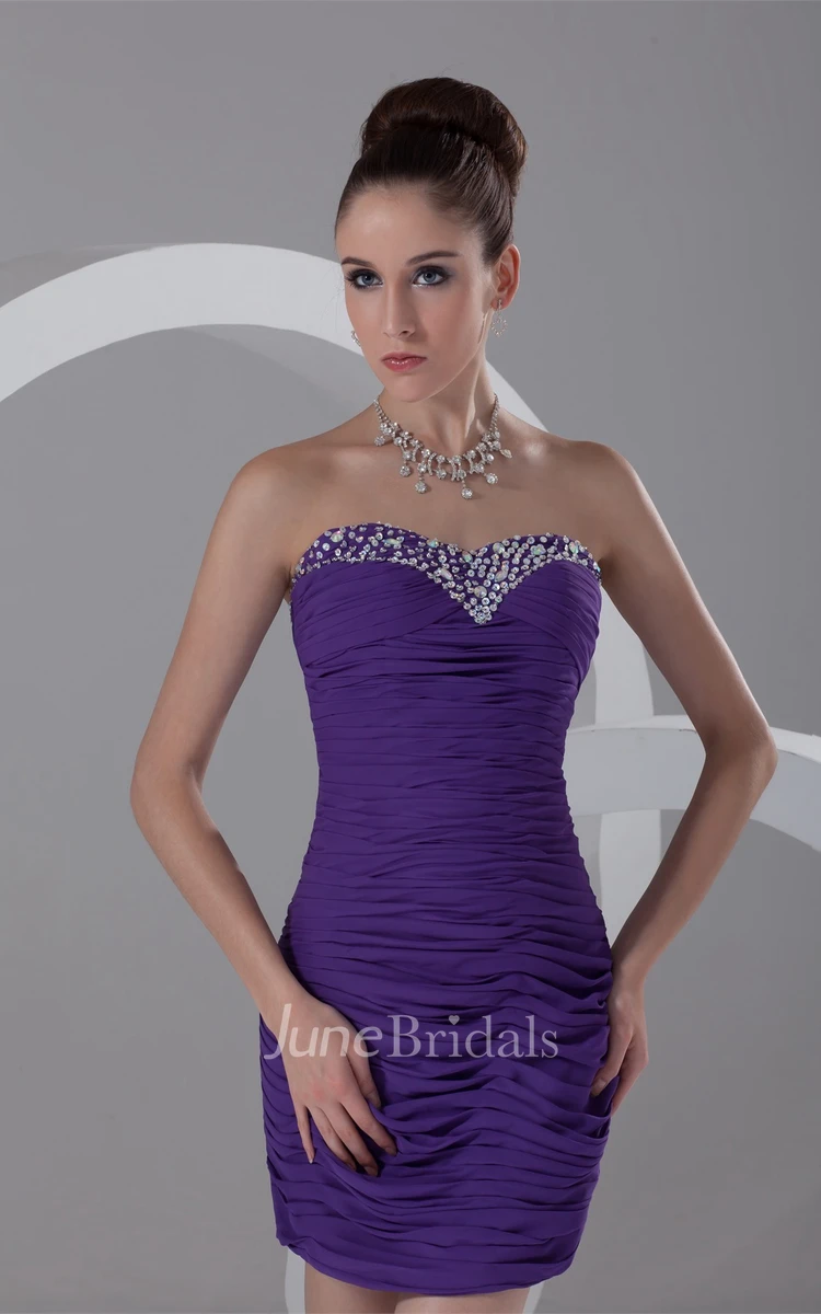 strapless mini body-fitting dress with overall ruched design and beading