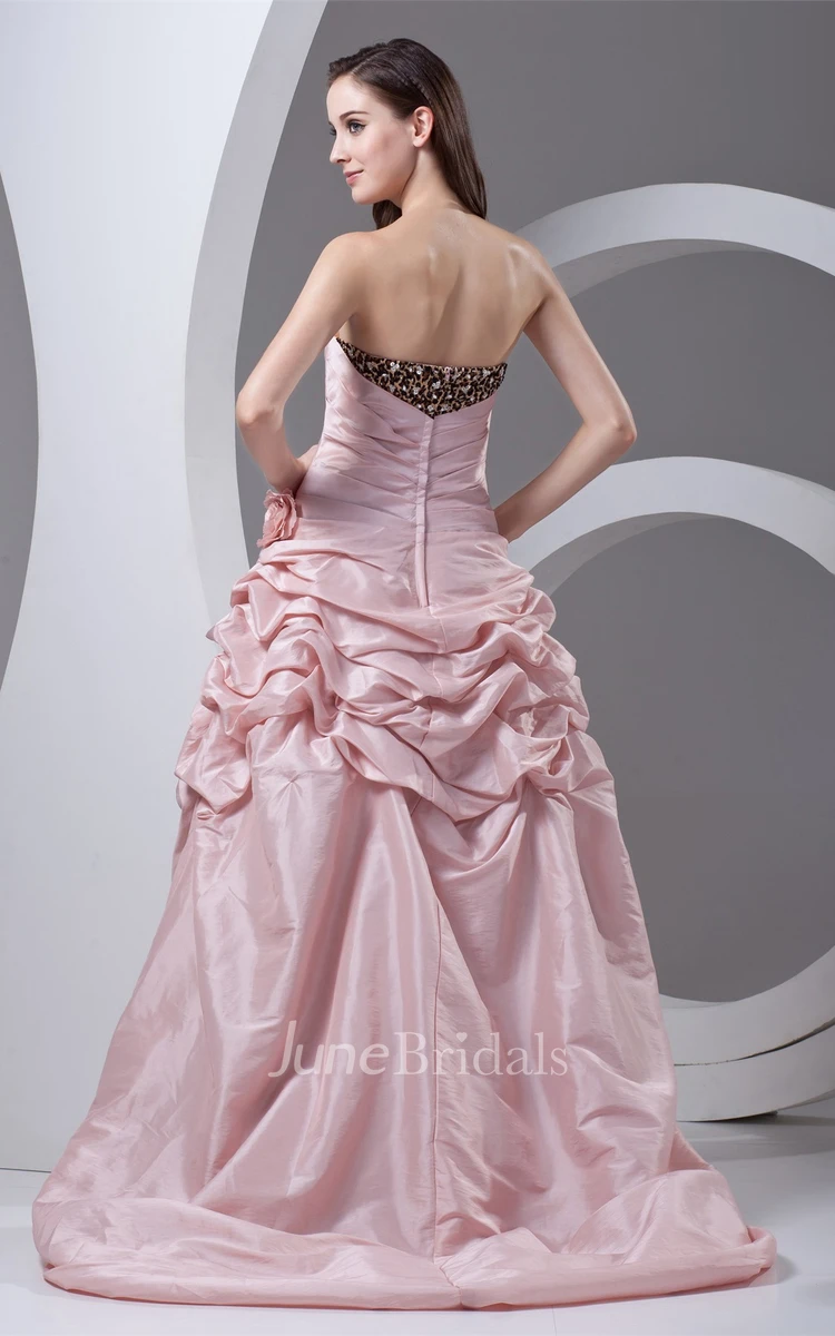 strapless high-low leopard gown with pick-up design and flower